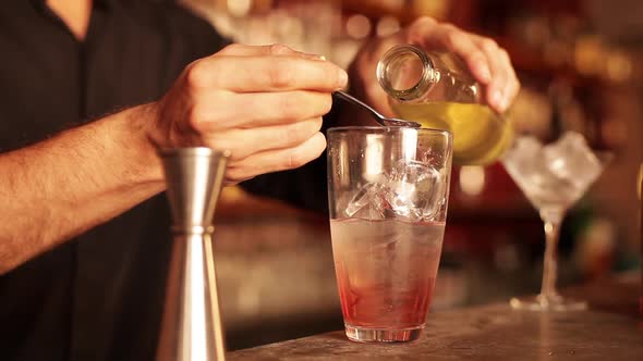 Bartender preparing cosmopolitan