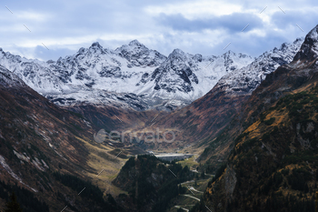 Snow-capped mountain range with valley below