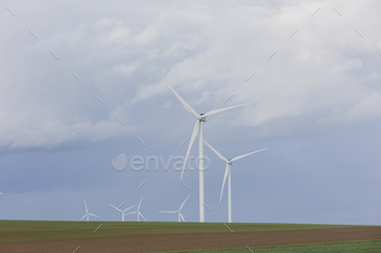 windmills in the countryside - renewable energy concept -
