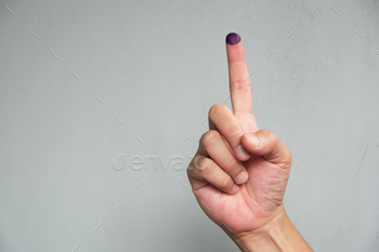 Purple ink applied on finger