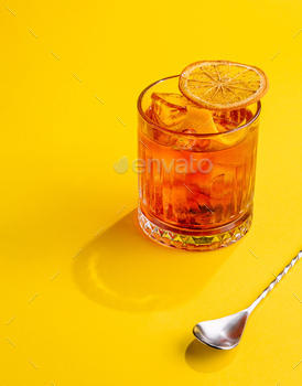 Cocktail Negroni on yellow background