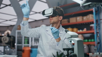 Goggles scientist touching augmented reality interface in laboratory close up.