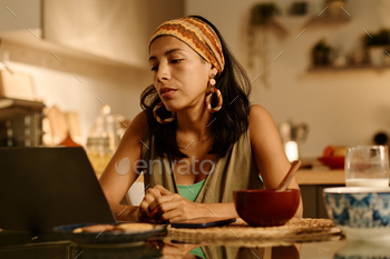 Businesswoman looking at laptop screen