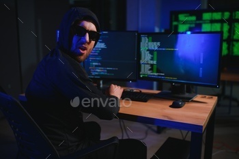 Hacker is hacking into the computer network. Computer criminal