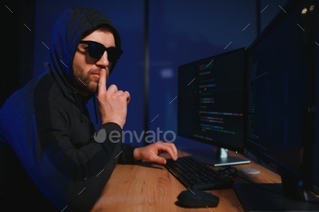 Hacker is hacking into the computer network. Computer criminal