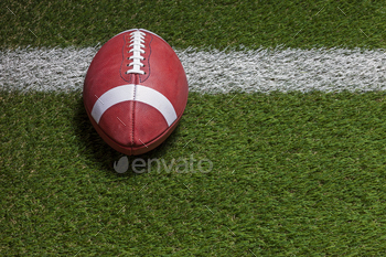 Football at the goal line on a grass field high angle view