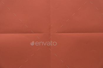 Folded red color paper for background.
