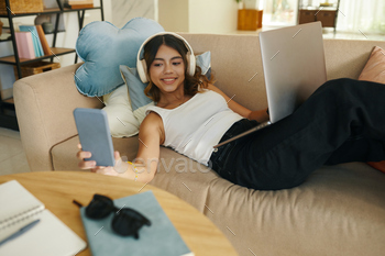 Girl Checking Notifications on Phone when Studying