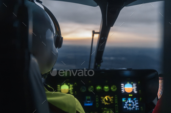 Helicopter emergency medical service flying at dusk