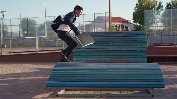 Businessman is Running Fast with Business Briefcase in His Hands Rushing to Work