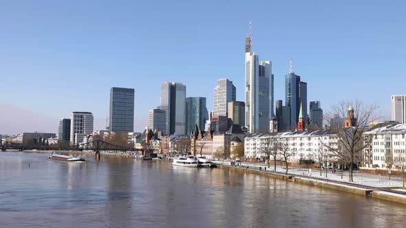 Frankfurt Skyline And Eiserner Steg (Iron Footbridge) Over Main River With Barge Ship From Alte Bruc