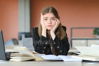 education and school concept - student girl studying and reading book at school.