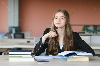girl at the desk in school