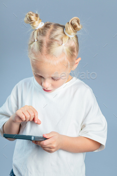 Cute girl holding calculator and learning to count