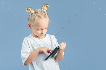 Cute girl holding calculator and learning to count