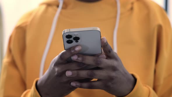 African American Girl Using Smartphone Pressing Finger Reading Social Media Internet Typing Text or