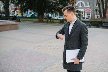 Young business man with documents.
