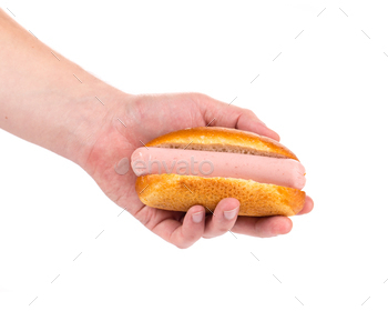 Tasty hotdog in hand.