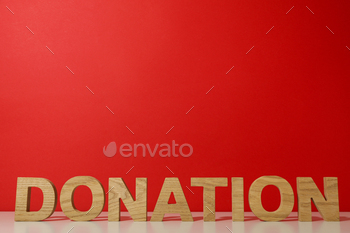 The word donation on a red background.