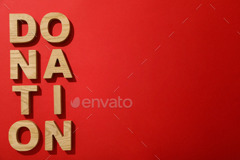 The word donation on a red background.