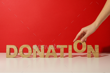 The word donation on a red background.