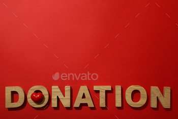 The word donation on a red background.