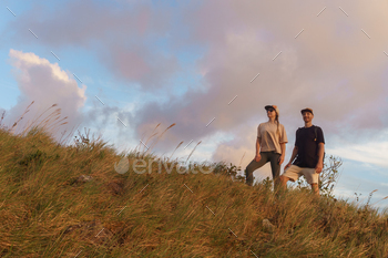 Couple in the mountain watching the sunset