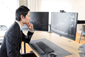 Hand of a businessman checking stock prices