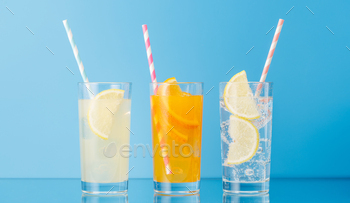 Various lemonade with ice in glasses