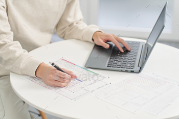 Hand of a man using accounting software