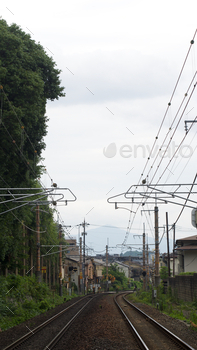 Railroad tracks with overhead power lines