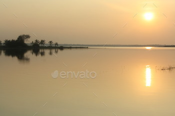 Sunset on the banks of a lake in Mysore, India