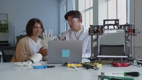 Close Up View of a Teacher and Pupil in the Laboratory