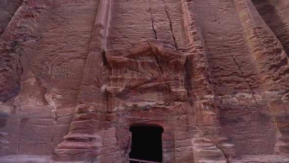 A Reveal Shot Of Ancient Temple Facade Carved Out Of The Sandrock In Ancient City Of Petra