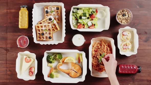 Food Delivery Top View Take Away Meals in Disposable Containers on Wooden Table