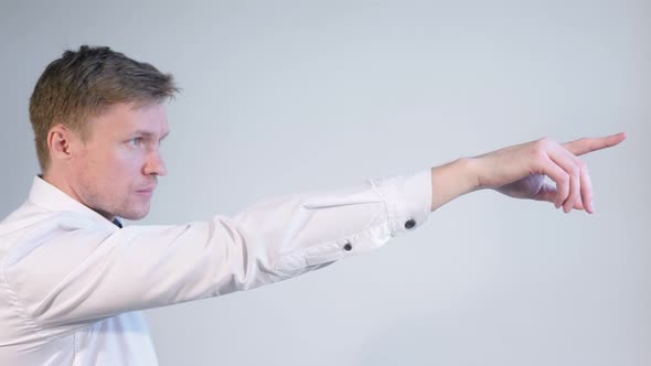 Side View of Man Pointing with Finger White Background