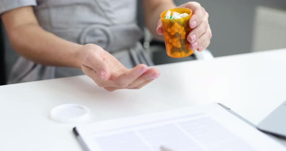 Woman Pouring Lot of Medication Capsules in Palm at Office  Movie