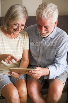 Happy mature people using digital online tablet together Elderly lifestyle people