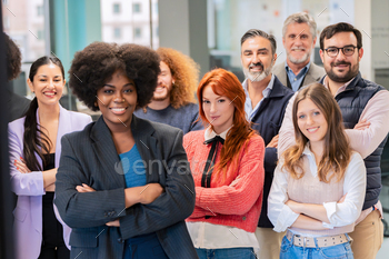 Diverse team smiling confidently in office.