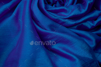 a close up of the royal blue silk that's covering up