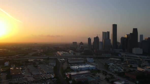 Panning left along Houston skyline toward sunset