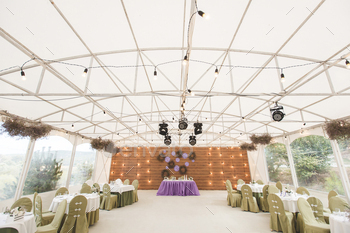 Wedding reception in a white tent.