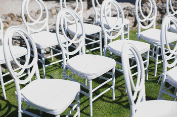 White chair decorating for wedding ceremony