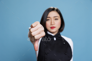 Waitress showcasing disapproval gesture
