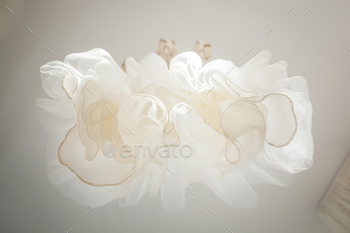 White wedding dress on a hanger.