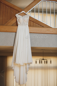 White wedding dress on a hanger.