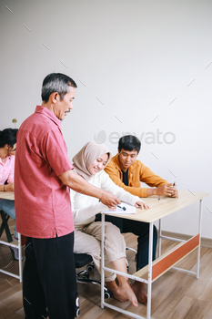 Teacher Helping Student
