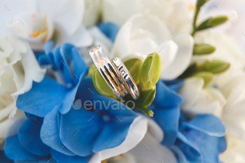 Wedding rings on wedding bouquet.