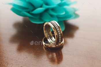 Wedding rings on wooden background