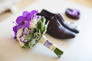 Accessories for the groom on the wedding day. Wedding bouquet and shoes.